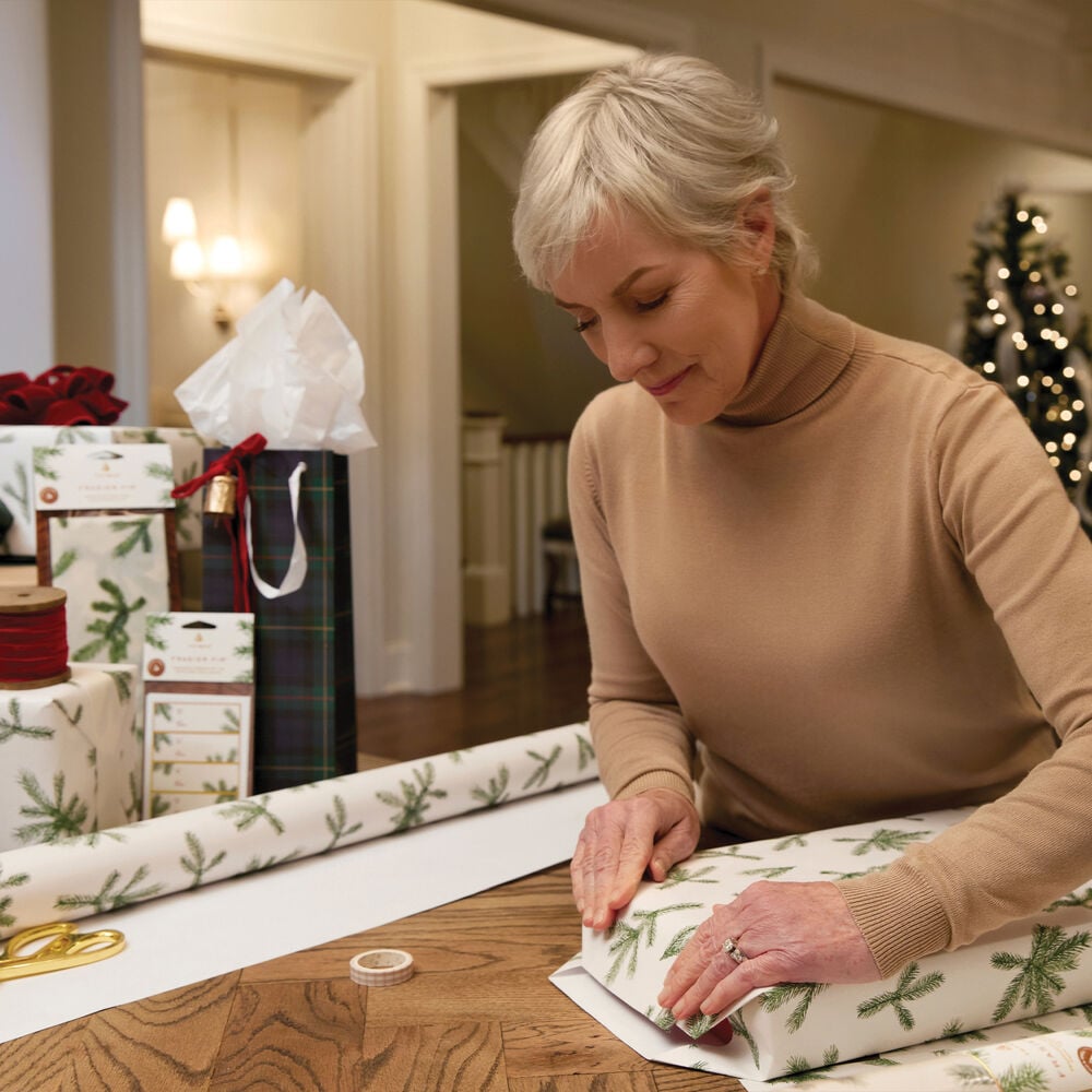 Gift being wrapped with Thymes Frasier Fir Fragranced Wrapping Paper  image number 4