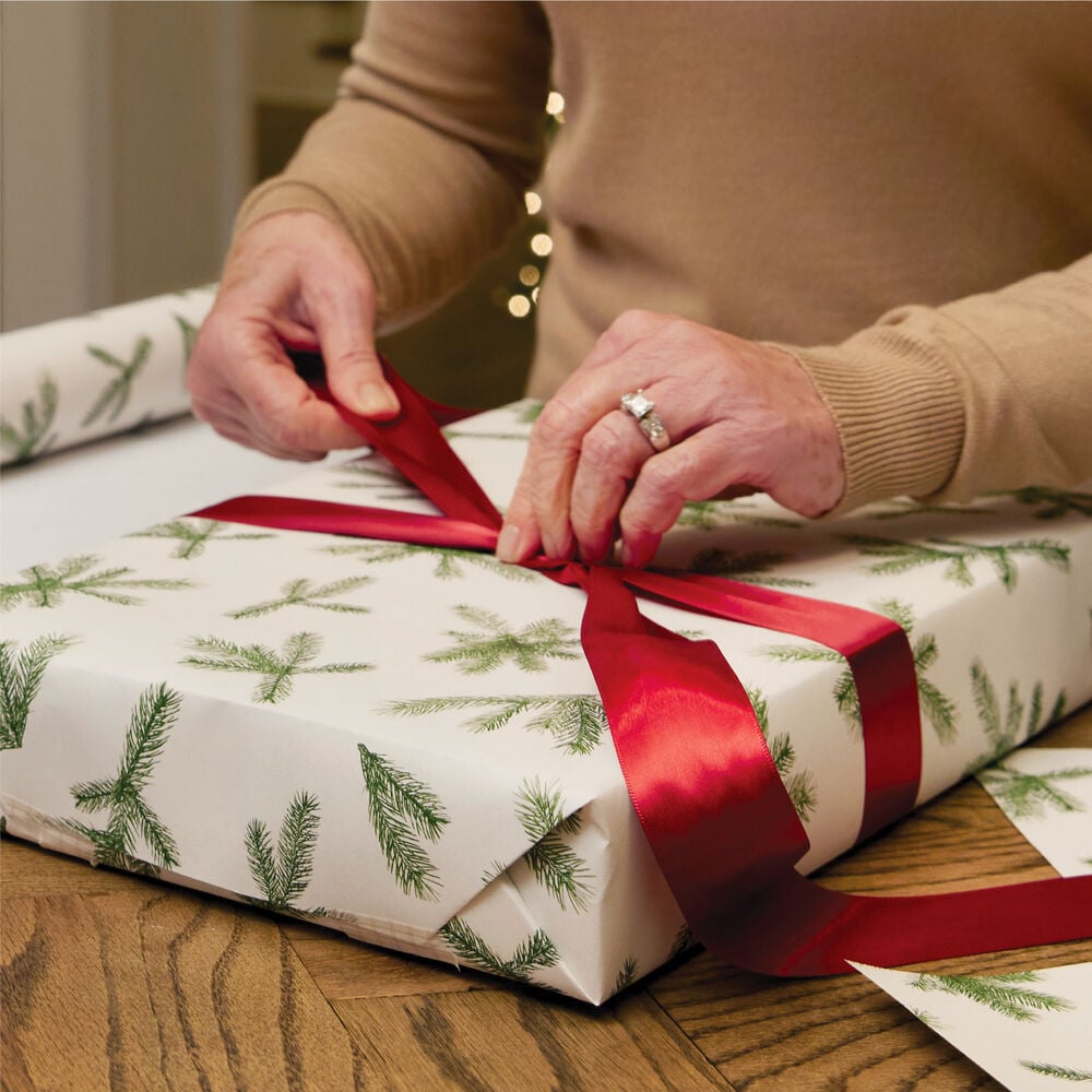 Gift being wrapped with Thymes Frasier Fir Fragranced Wrapping Paper  image number 3